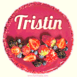 Beautifully decorated red velvet berry birthday cake with vibrant fruits and a glowing 'Tristin' name, adding a touch of sweetness and sparkle.