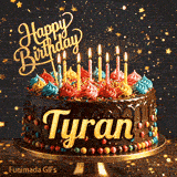Bold golden lettering spelling Tyran on a gourmet chocolate cake decorated with small colorful candies at the base.