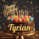 Yellow script spelling the name Tyrian on a classic chocolate cake with a dark glaze under warm candlelight.