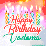 Bright birthday candles with rainbow flames on a cake, alongside the text 'Happy Birthday Vadoma' in vibrant script in this celebratory animated GIF.