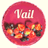 Beautifully decorated red velvet berry birthday cake with vibrant fruits and a glowing 'Vail' name, adding a touch of sweetness and sparkle.