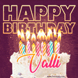 A colorful birthday cake topped with lit candles, with the words 'Happy Birthday Valli' in bold glowing letters on a burgundy background. Animated flames add a festive touch.