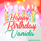 Bright birthday candles with rainbow flames on a cake, alongside the text 'Happy Birthday Vanida' in vibrant script in this celebratory animated GIF.