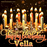 A glowing personalized birthday GIF with name Vella featuring lit candles with intricate designs, warm lighting, and the text 'Happy Birthday' in an elegant font.