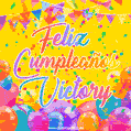 A bright and festive GIF with the text 'Feliz Cumpleaños Victory' in Spanish in colorful fonts, surrounded by confetti, balloons, and festive banners on a vibrant yellow background.