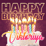 A colorful birthday cake topped with lit candles, with the words 'Happy Birthday Viktoriya' in bold glowing letters on a burgundy background. Animated flames add a festive touch.