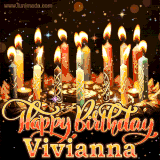 A glowing personalized birthday GIF with name Vivianna featuring lit candles with intricate designs, warm lighting, and the text 'Happy Birthday' in an elegant font.