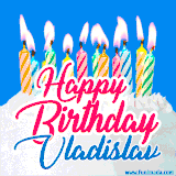 A cheerful animated GIF featuring colorful lit birthday candles on a white cake, with the text 'Happy Birthday Vladislav' in bold red and blue script on a bright blue background.
