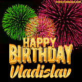 A captivating GIF with bursts of green, pink, and orange fireworks lighting up the night sky, accompanied by 'Happy Birthday Vladislav' in glowing golden text.