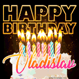 A vibrant animated GIF featuring a delicious birthday cake topped with glowing candles and the name 'Vladislav' in elegant script, and the words 'Happy Birthday' on the black background.