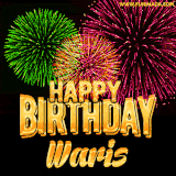 A captivating GIF with bursts of green, pink, and orange fireworks lighting up the night sky, accompanied by 'Happy Birthday Waris' in glowing golden text.
