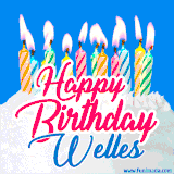 A cheerful animated GIF featuring colorful lit birthday candles on a white cake, with the text 'Happy Birthday Welles' in bold red and blue script on a bright blue background.