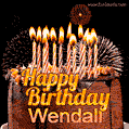 A rich chocolate cake topped with glowing birthday candles and surrounded by bright fireworks. The animated GIF displays the message 'Happy Birthday Wendall' in golden text.