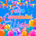 A vibrant animated GIF with 'Feliz Cumpleaños Weslee' written in colorful script, surrounded by balloons, confetti, and bunting on a bright blue background.