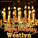 A glowing personalized birthday GIF with name Westlyn featuring lit candles with intricate designs, warm lighting, and the text 'Happy Birthday' in an elegant font.