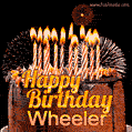 A rich chocolate cake topped with glowing birthday candles and surrounded by bright fireworks. The animated GIF displays the message 'Happy Birthday Wheeler' in golden text.