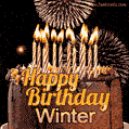 A glowing personalized birthday GIF with name Winter featuring lit candles with intricate designs, warm lighting, and the text 'Happy Birthday' in an elegant font.
