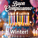 Birthday cake topped with pink and yellow lit candles, surrounded by glowing bokeh lights and party balloons. The greeting 'Buon Compleanno Winter GIF!' is displayed.