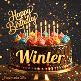 Close-up of a chocolate birthday cake with multicolored frosting swirls and colorful candy beads around the gold base. Greeting text with name Winter