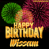 A captivating GIF with bursts of green, pink, and orange fireworks lighting up the night sky, accompanied by 'Happy Birthday Wissam' in glowing golden text.