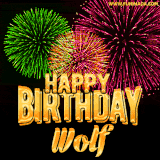 A captivating GIF with bursts of green, pink, and orange fireworks lighting up the night sky, accompanied by 'Happy Birthday Wolf' in glowing golden text.