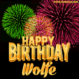 A captivating GIF with bursts of green, pink, and orange fireworks lighting up the night sky, accompanied by 'Happy Birthday Wolfe' in glowing golden text.