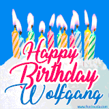 A cheerful animated GIF featuring colorful lit birthday candles on a white cake, with the text 'Happy Birthday Wolfgang' in bold red and blue script on a bright blue background.