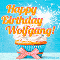 A cheerful animated GIF of a cupcake with creamy frosting, a red checkered ribbon, and a bright sparkler on top. The text 'Happy Birthday Wolfgang!' is displayed in vibrant orange and red.