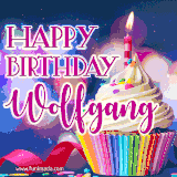 A festive animated GIF featuring a colorful cupcake with a single lit candle, sprinkles, and 'Happy Birthday Wolfgang' text against a sparkling, celebratory background.