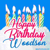 A cheerful animated GIF featuring colorful lit birthday candles on a white cake, with the text 'Happy Birthday Woodson' in bold red and blue script on a bright blue background.