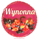 Beautifully decorated red velvet berry birthday cake with vibrant fruits and a glowing 'Wynonna' name, adding a touch of sweetness and sparkle.