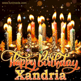 A glowing personalized birthday GIF with name Xandria featuring lit candles with intricate designs, warm lighting, and the text 'Happy Birthday' in an elegant font.
