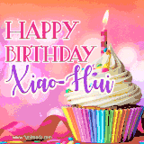 A vibrant birthday GIF featuring a rainbow-colored cupcake topped with white frosting, sprinkles, and a lit candle. The text reads 'Happy Birthday Xiao-Hui' in bold pink and violet letters with white outline.