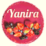 Beautifully decorated red velvet berry birthday cake with vibrant fruits and a glowing 'Yanira' name, adding a touch of sweetness and sparkle.