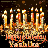 A glowing personalized birthday GIF with name Yashika featuring lit candles with intricate designs, warm lighting, and the text 'Happy Birthday' in an elegant font.