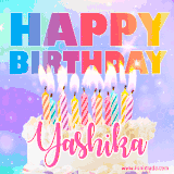 A vibrant animated name GIF with the words 'Happy Birthday Yashika' with colorful candles on a creamy cake. The background sparkles with pastel shades, adding a festive touch.