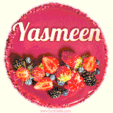 Beautifully decorated red velvet berry birthday cake with vibrant fruits and a glowing 'Yasmeen' name, adding a touch of sweetness and sparkle.