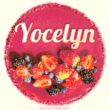 Beautifully decorated red velvet berry birthday cake with vibrant fruits and a glowing 'Yocelyn' name, adding a touch of sweetness and sparkle.