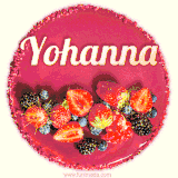Beautifully decorated red velvet berry birthday cake with vibrant fruits and a glowing 'Yohanna' name, adding a touch of sweetness and sparkle.