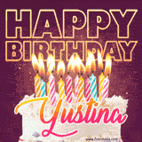 A colorful birthday cake topped with lit candles, with the words 'Happy Birthday Yustina' in bold glowing letters on a burgundy background. Animated flames add a festive touch.