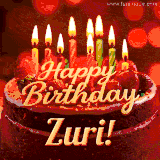Beautifully decorated red velvet berry birthday cake with vibrant fruits and a glowing 'Zuri' name, adding a touch of sweetness and sparkle.