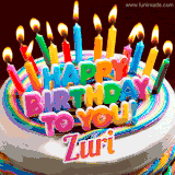A colorful birthday cake topped with lit candles, with the words 'Happy Birthday Zuri' in bold glowing letters on a burgundy background. Animated flames add a festive touch.