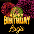 A golden 'Happy Birthday Łucja' message with vibrant fireworks in the background, creating a festive and celebratory vibe in this animated name GIF.