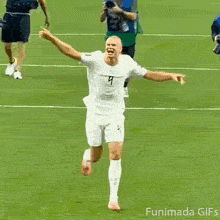 Goofy goal celebration showing professional footballer Erling Haaland sprinting across the pitch, waving his arms in pure excitement with a funny wide mouth scream.