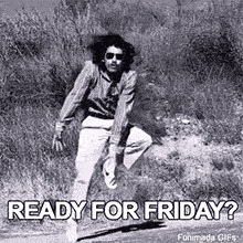 A man with a large afro and sunglasses dances energetically outdoors in a black and white animated GIF. He wears a striped shirt and kicks up dust, with text below asking 'Ready for Friday?'.