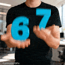 A person in a plain black t-shirt juggles two large, bright blue 3D numbers, a six and a seven. The action is a smooth, continuous loop set against the backdrop of a modern, blurred office.
