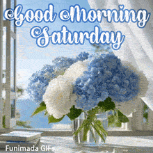 Coastal morning scene showing a bouquet of blue and white flowers in a vase on a windowsill. Sheer curtains blow in the breeze near the blue greeting Good Morning Saturday.