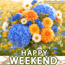 Fresh mixed flower arrangement featuring large blue hydrangeas bright orange dahlias white daisies and delicate filler blooms rests on light wood below the clear HAPPY WEEKEND lettering with a warm outdoor garden background