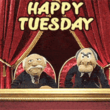 An animated GIF of the Muppets Statler and Waldorf in their theater balcony box. The text 'HAPPY TUESDAY' is displayed above them against the red stage curtains.
