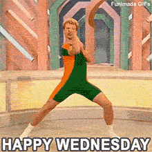 An enthusiastic man with curly blonde hair wearing a green and orange spandex unitard performs a wide stance and punches his arms. He is on a pastel geometric stage behind the text 'HAPPY WEDNESDAY'.